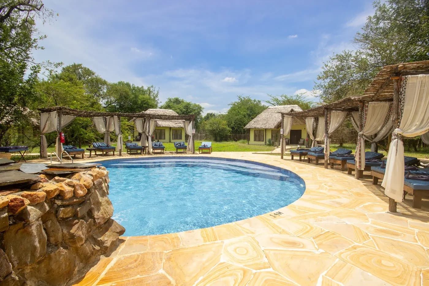 Swimming pool and shaded loungers