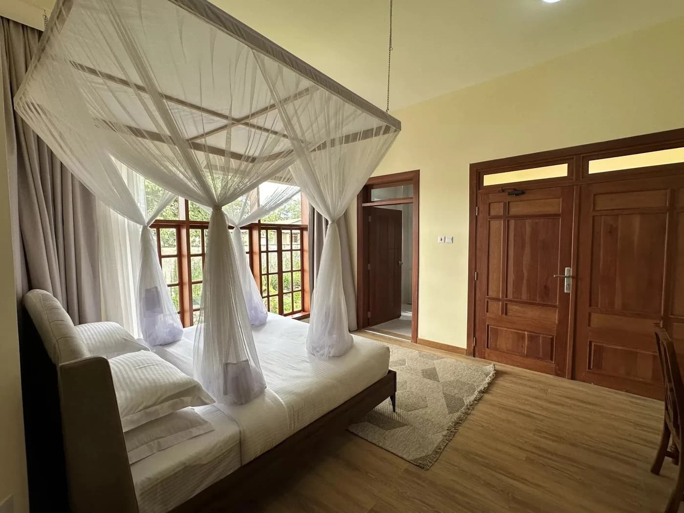 Room with a sofa and garden windows