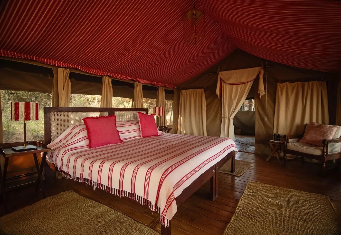 Tent interior with a striped bedspread
