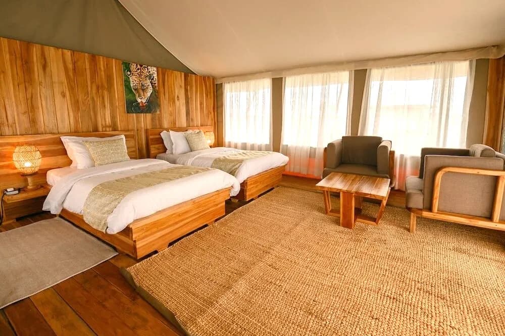 Twin tent with armchairs by the windows