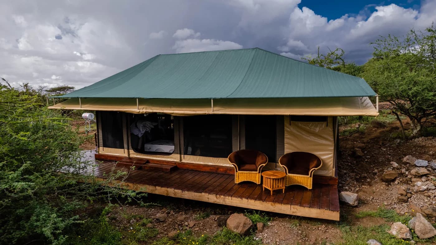 A guest tent with chairs on the veranda