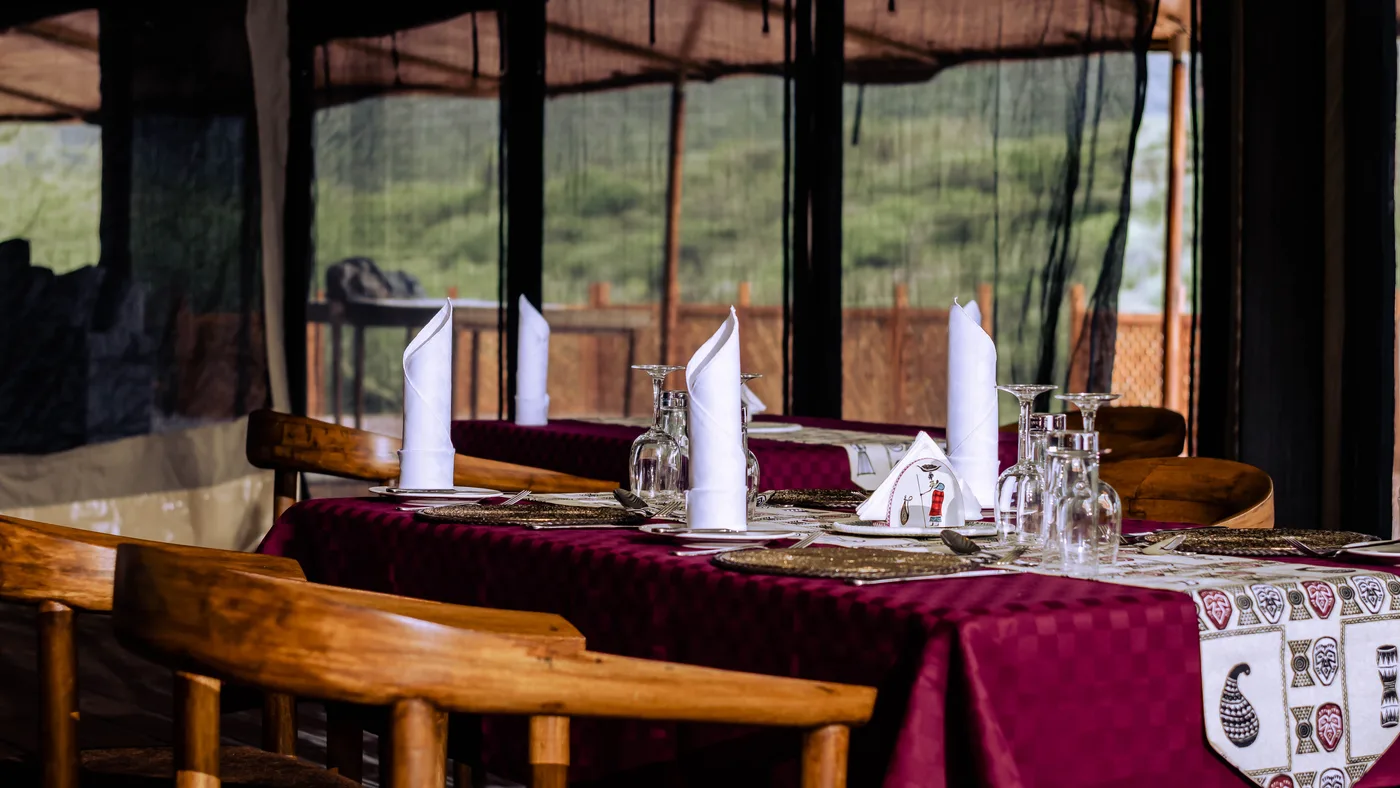 Tables set in the dining tent