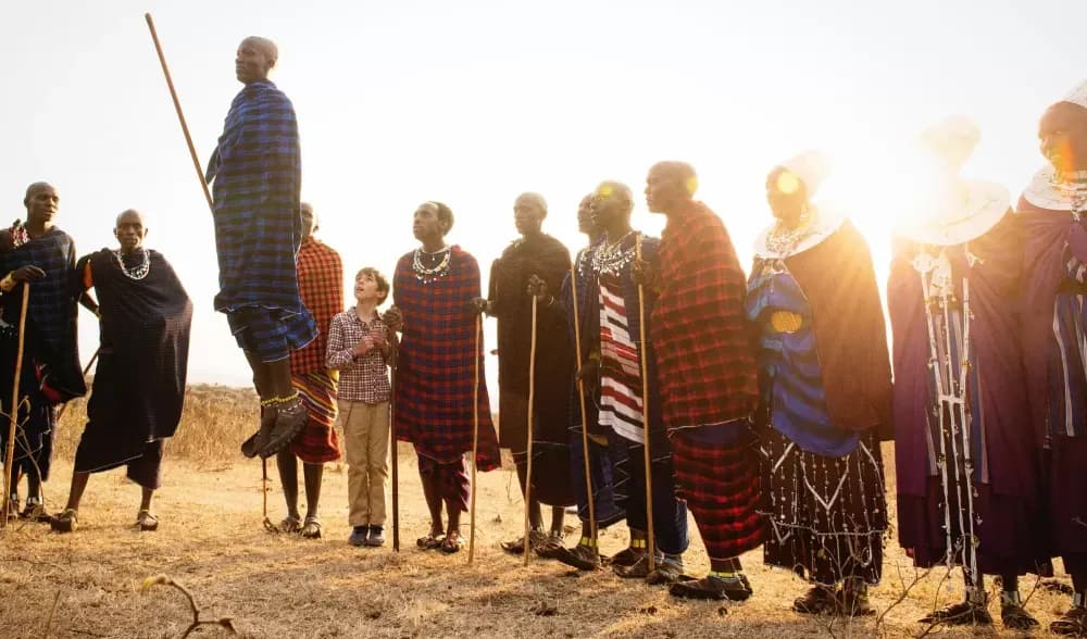 Guests and Maasai at sunset