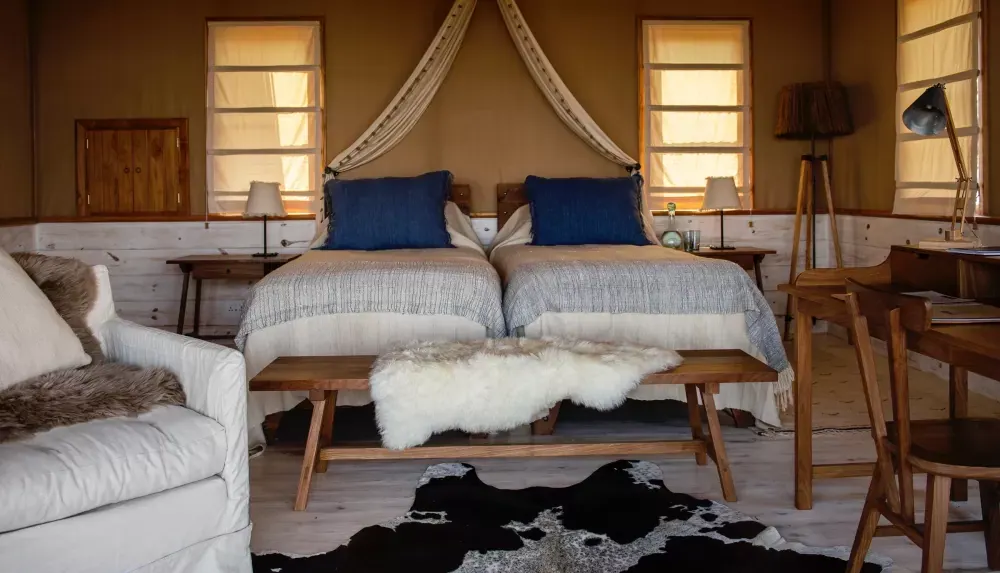 Twin beds with blue headboards