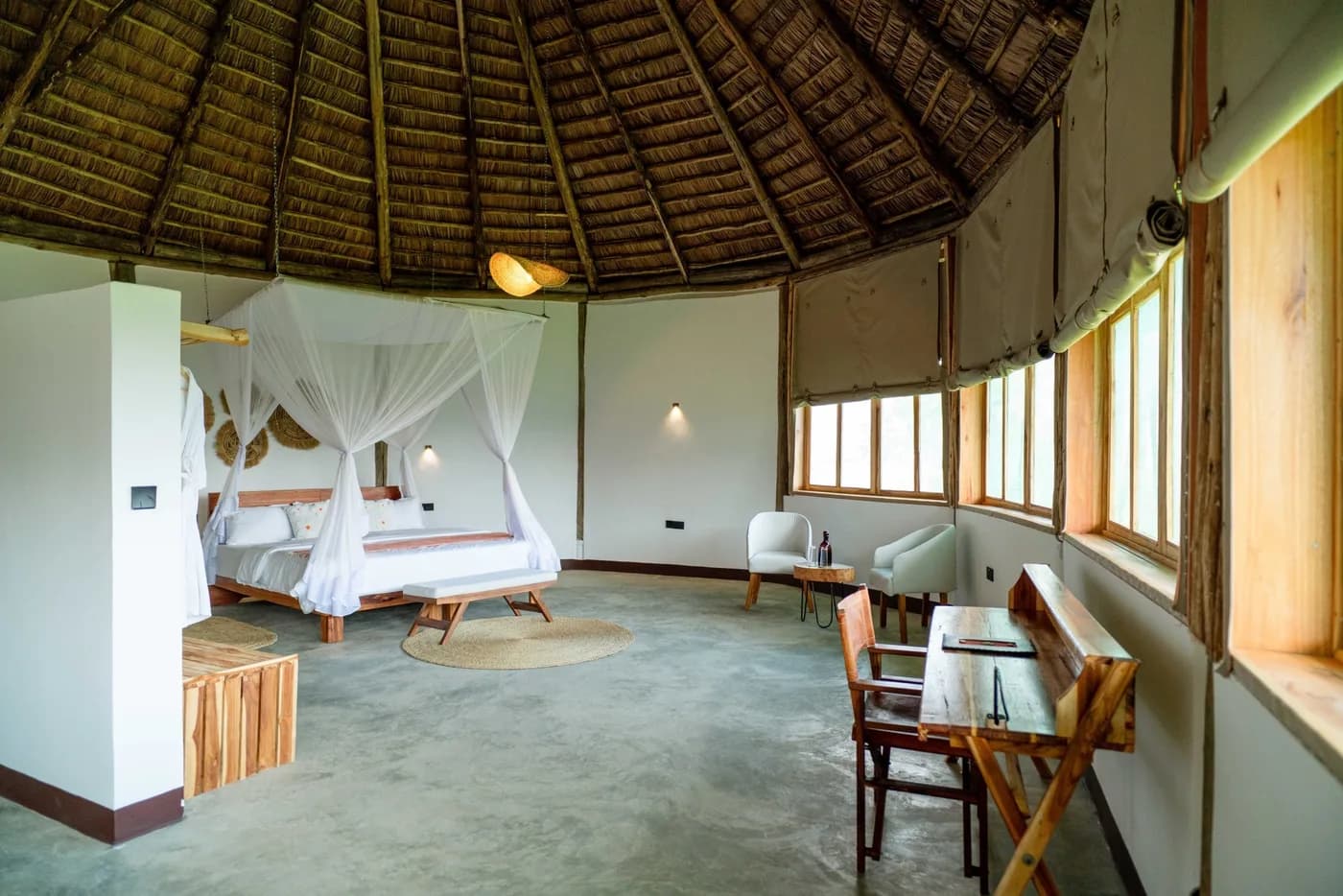 Suite with a canopied bed and sitting area