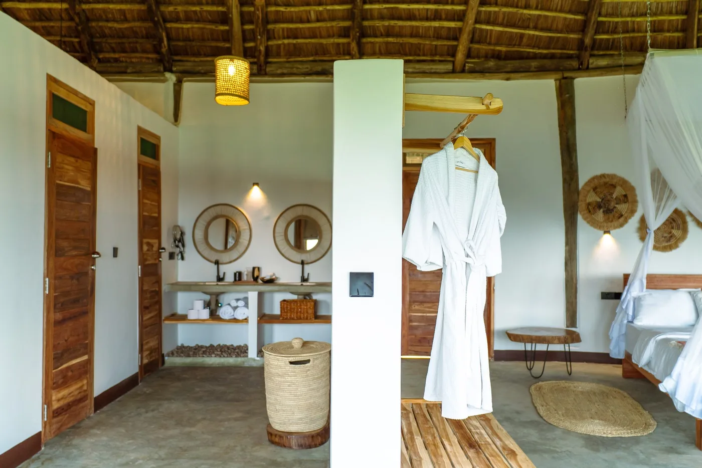 Bathroom with a robe and twin basins