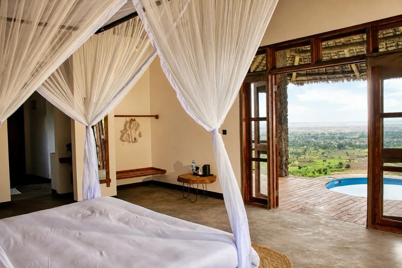 Bed with a view through open doors