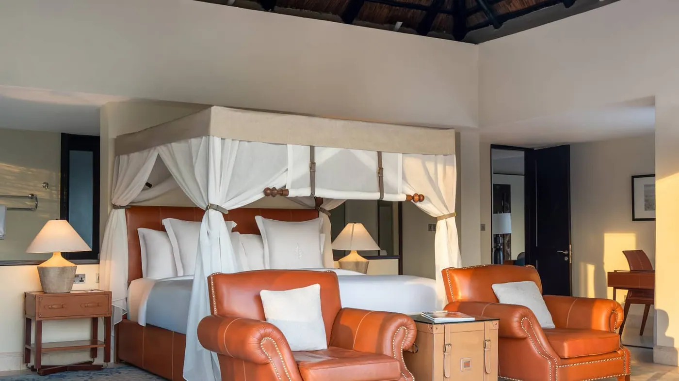 Suite bedroom with canopied bed
