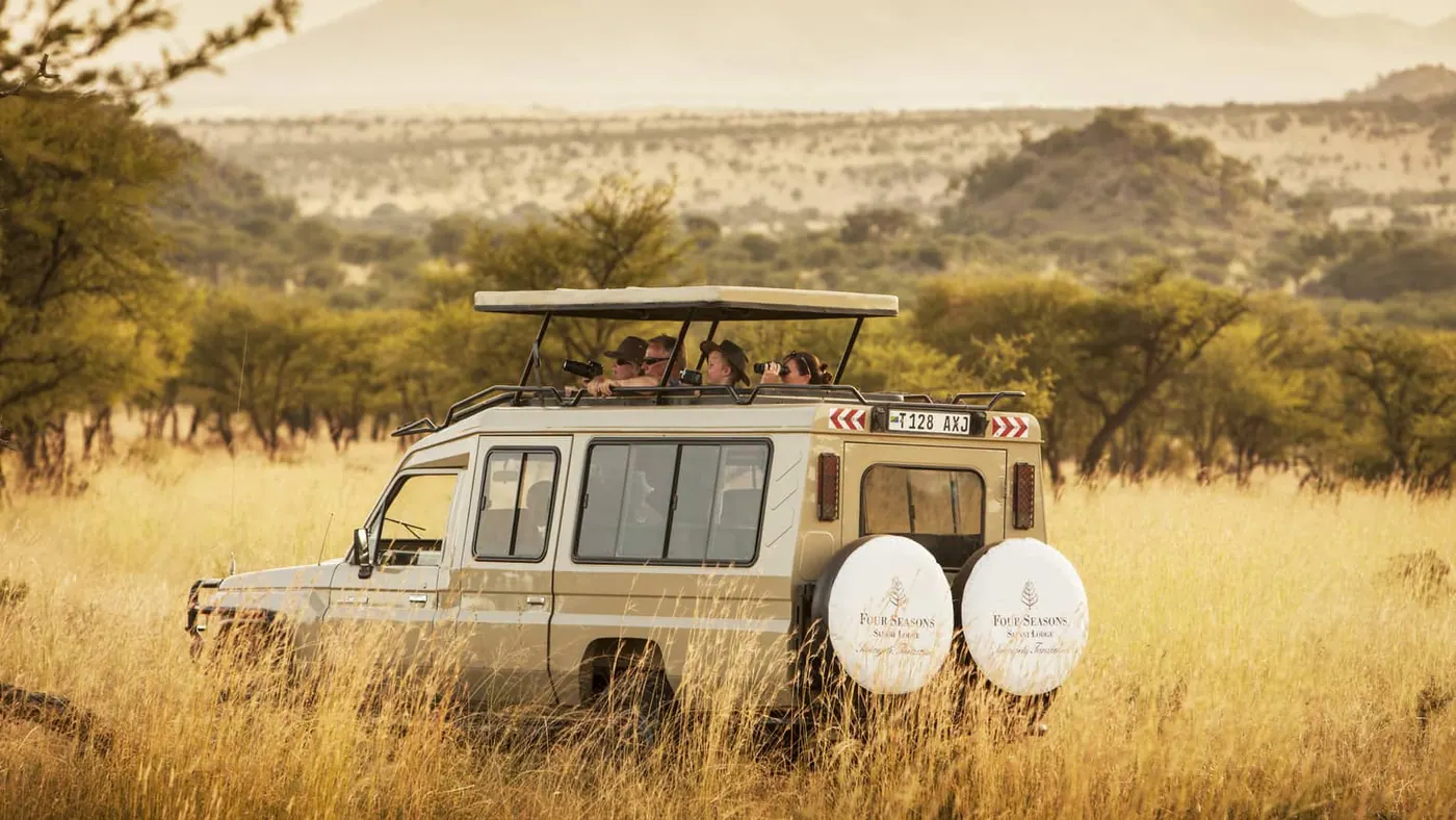Branded game-drive vehicle on the plains
