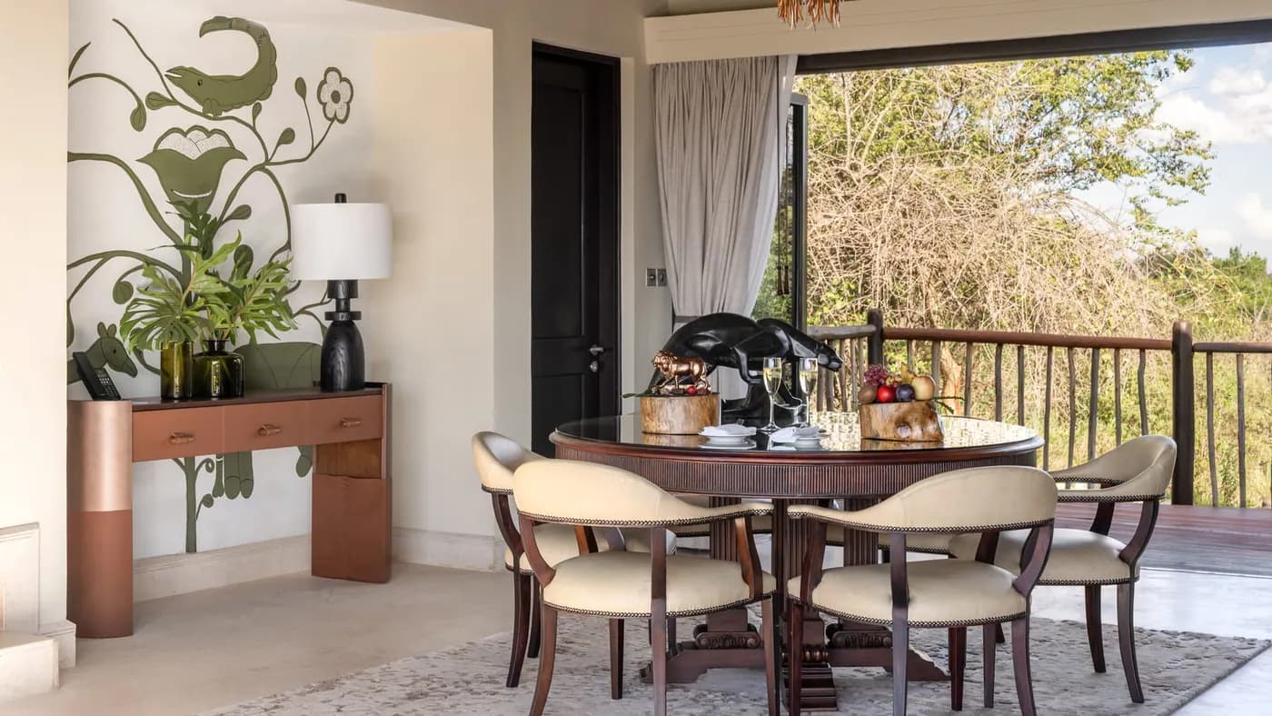 In-room dining table beside the terrace door
