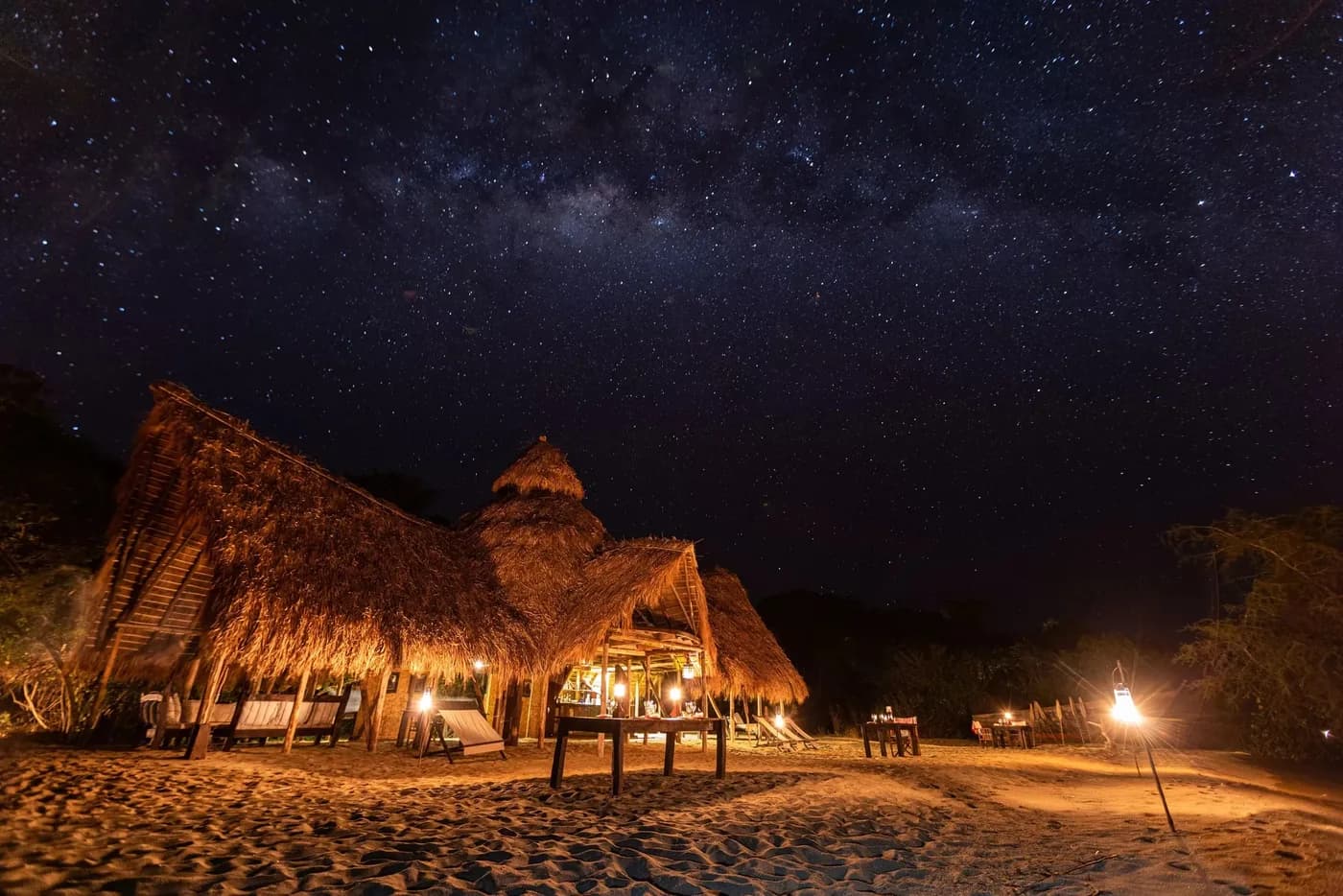 The main mess lit up under the stars