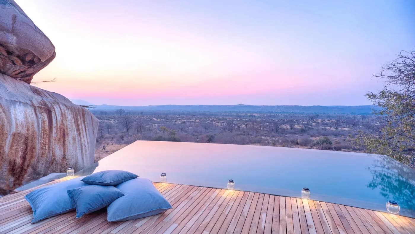 Infinity pool over the bush at dusk