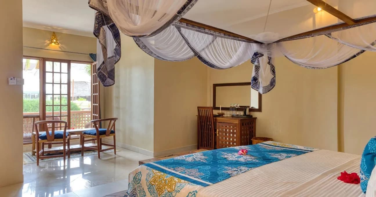 Bed under a carved canopy