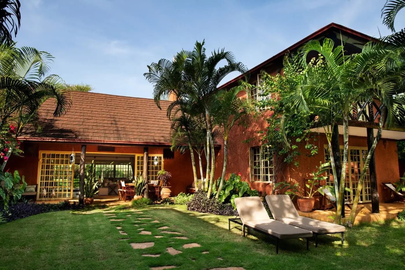 Villa exterior with garden loungers
