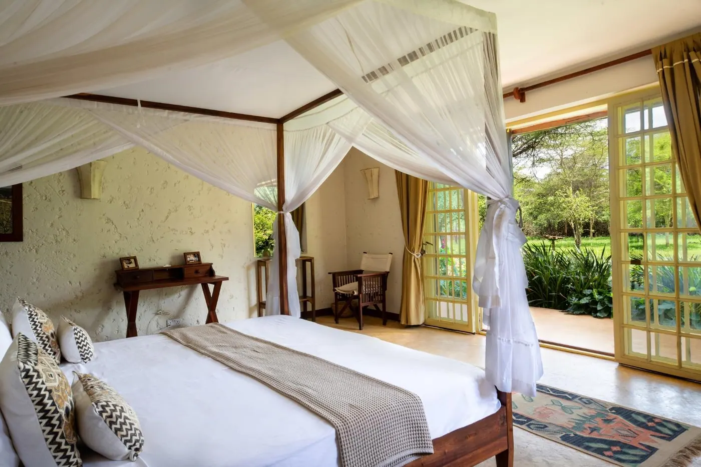 Four-poster bed under a net