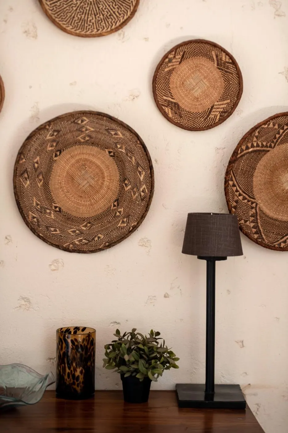 Woven platters on the lounge wall
