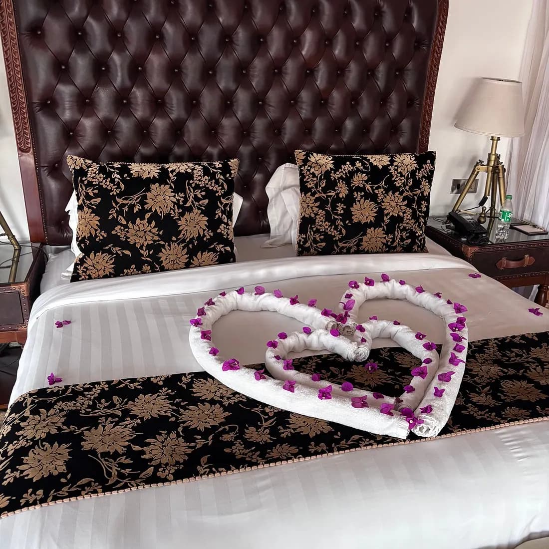Bed dressed with a petal heart