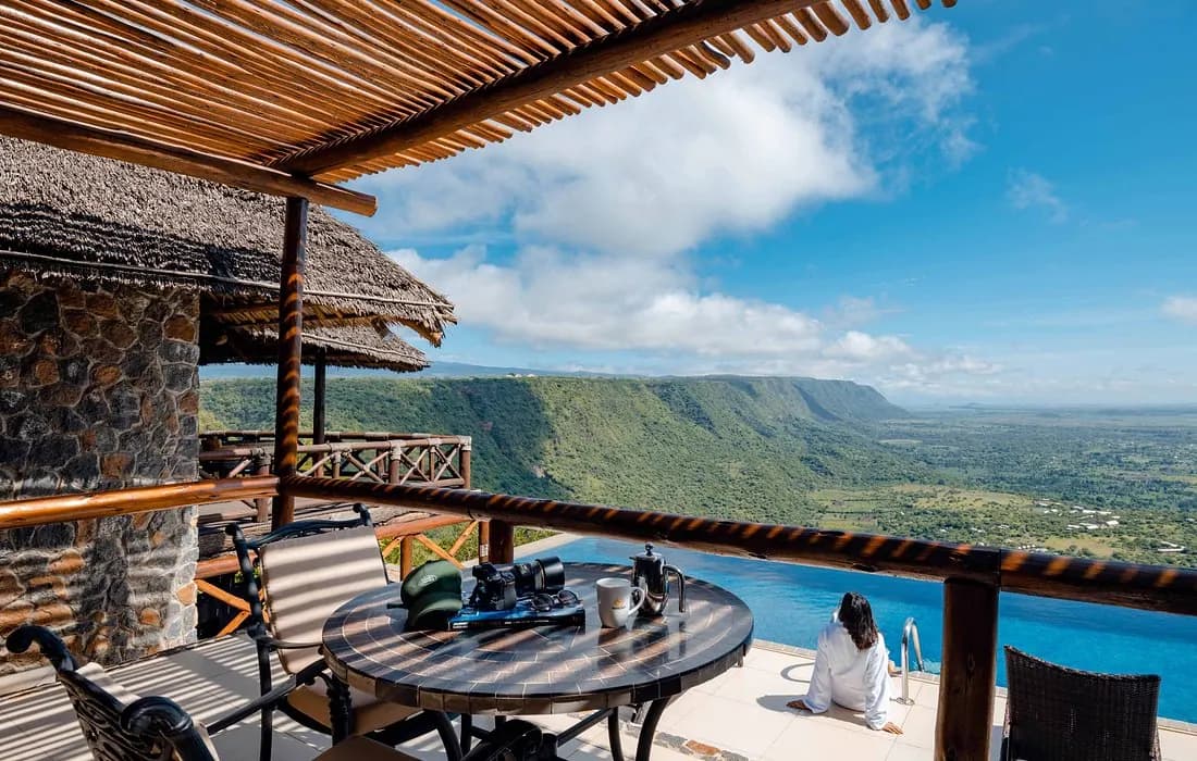 Table on the deck, pool below