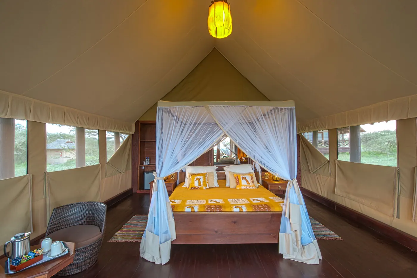 Tented room with a yellow throw
