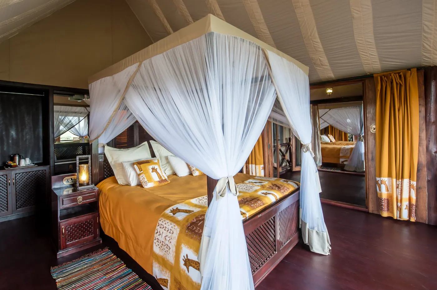 Canopied bed with a gold throw