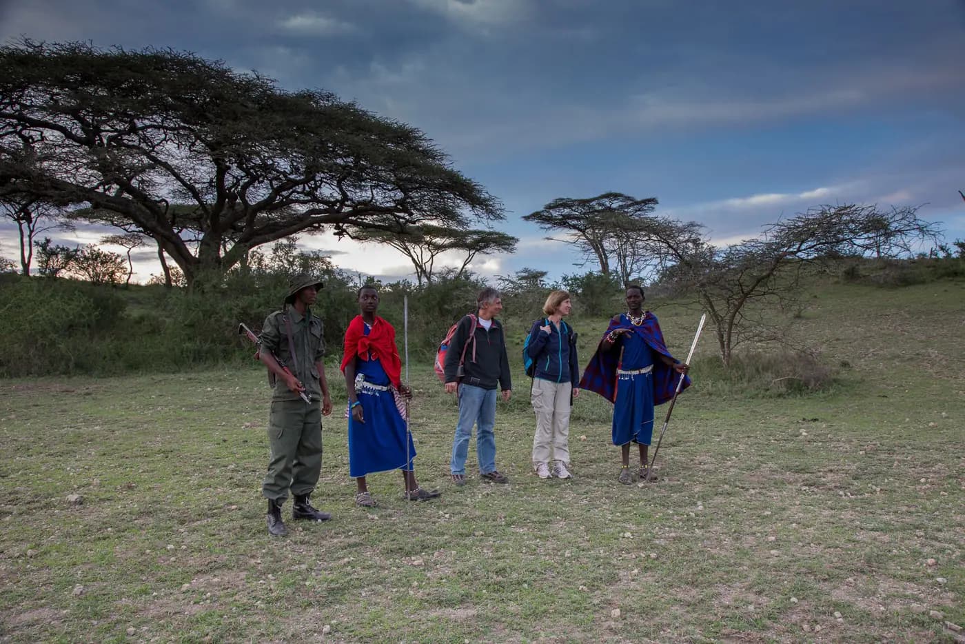 Guests and Maasai guides on the plain