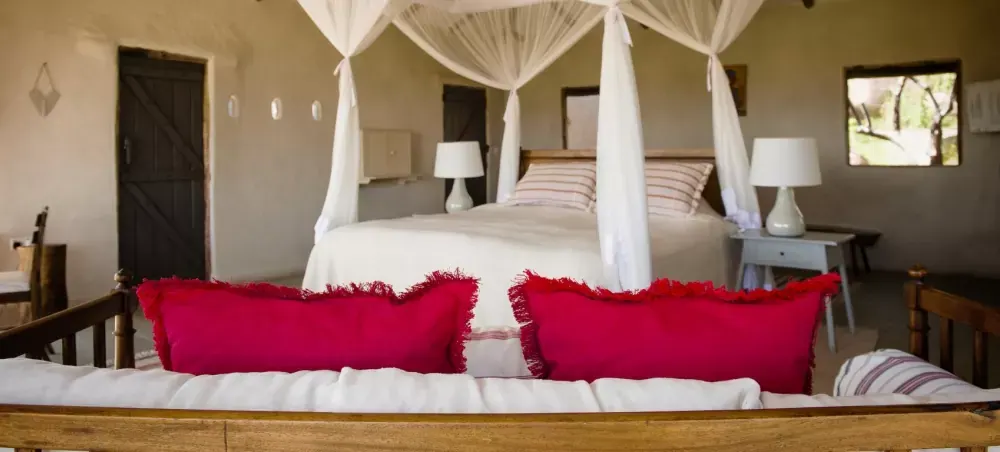 Bed with red cushions