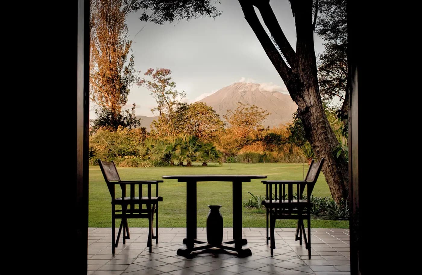 Table set with Mount Meru beyond