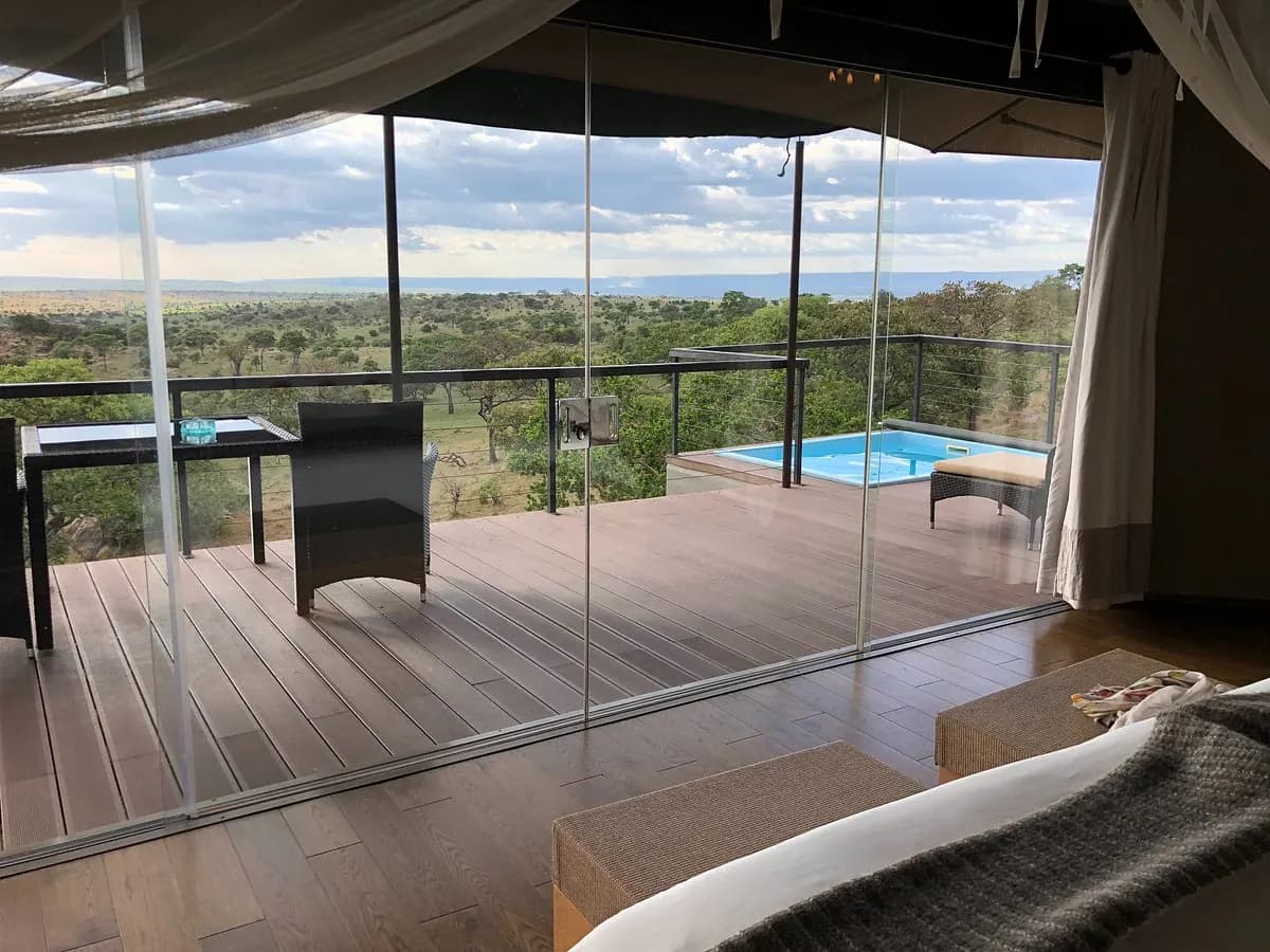 Glass-walled suite opening to the deck
