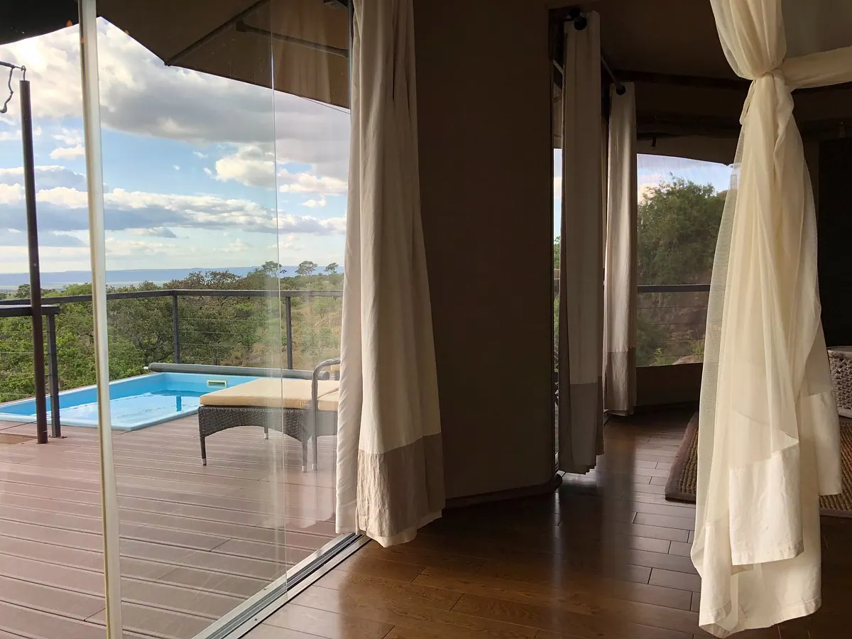 Suite drapes open to the pool