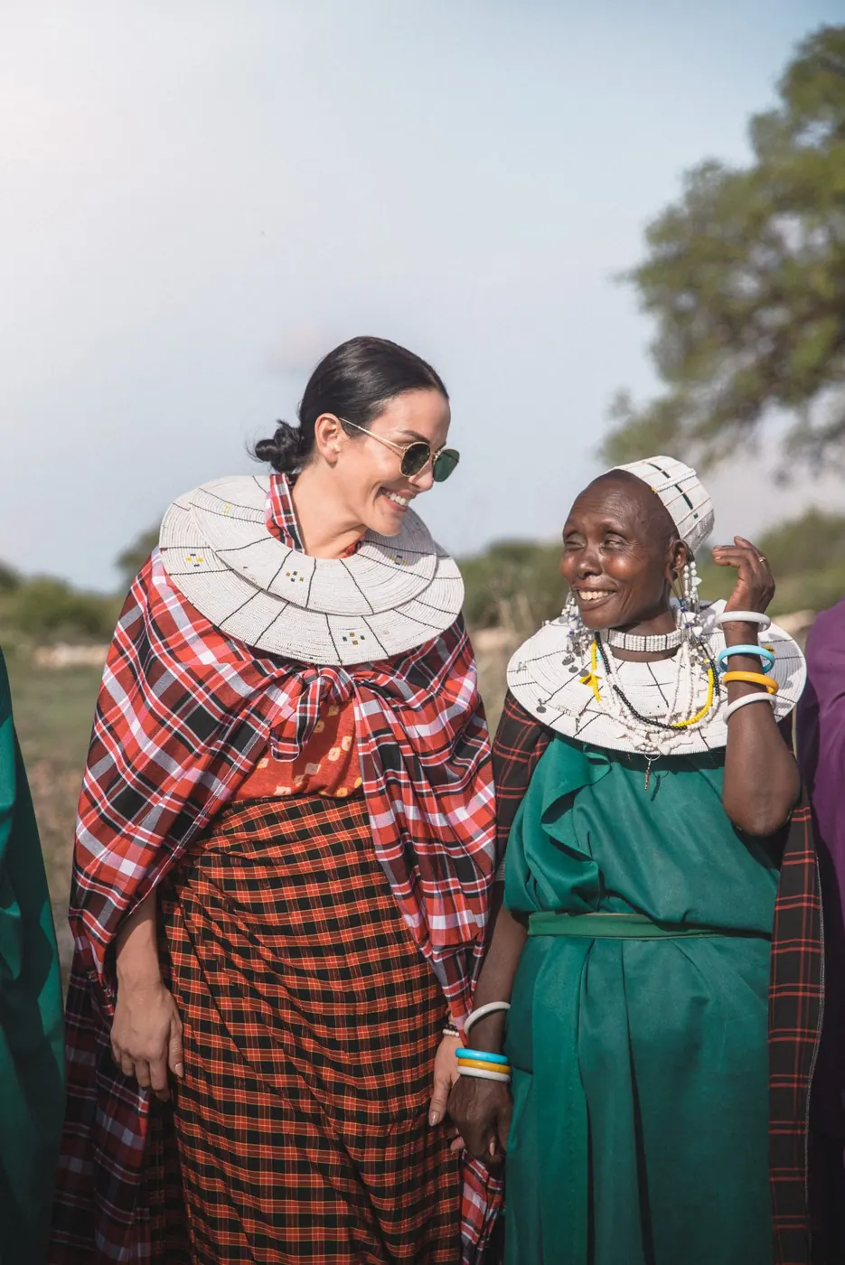 Guests in Maasai dress with the staff