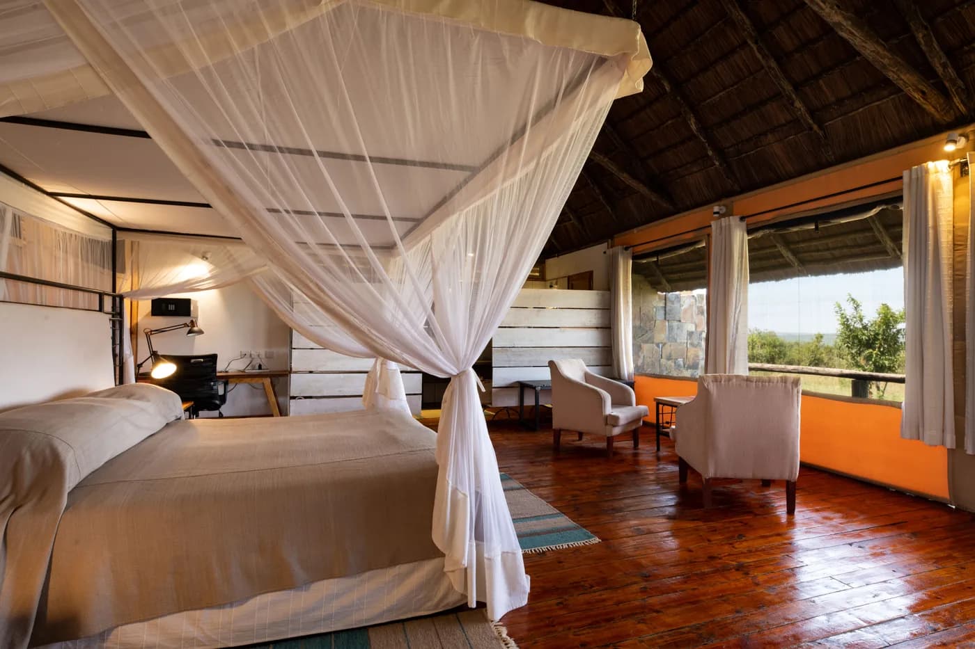 Bed under a mosquito net