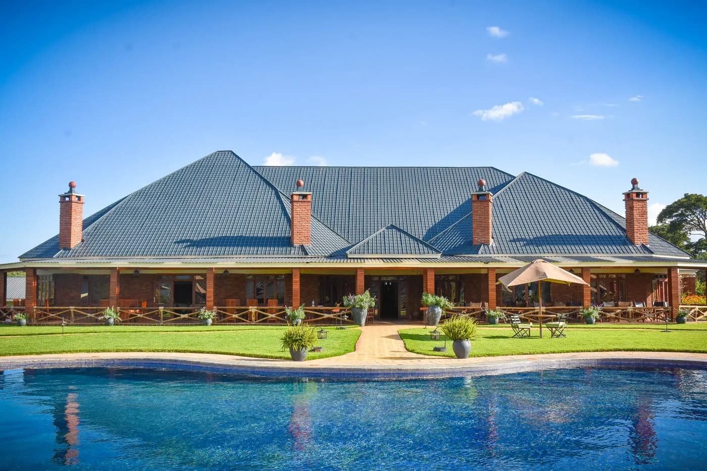 Pool and main building on a clear day