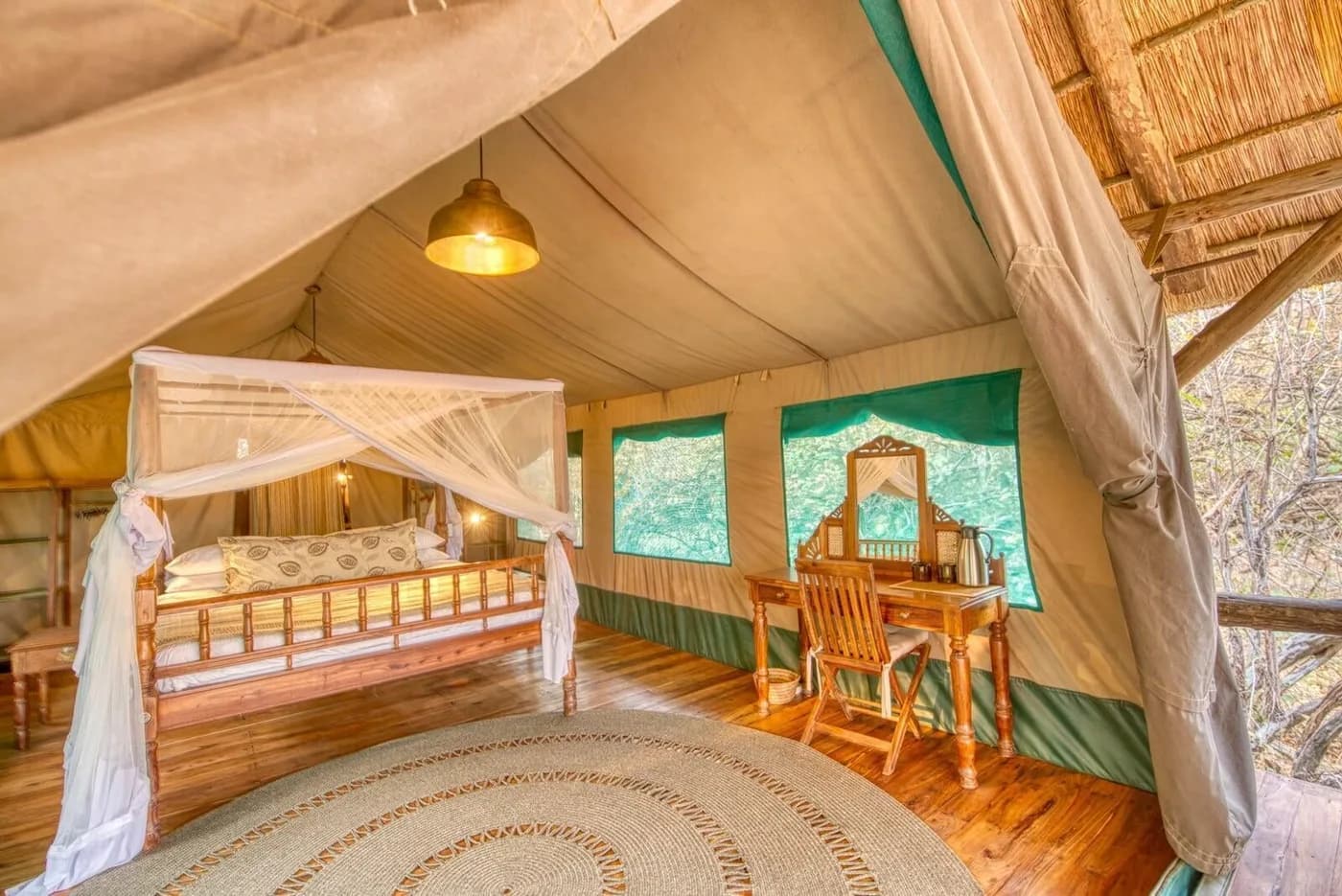 Tented room with a canopied bed