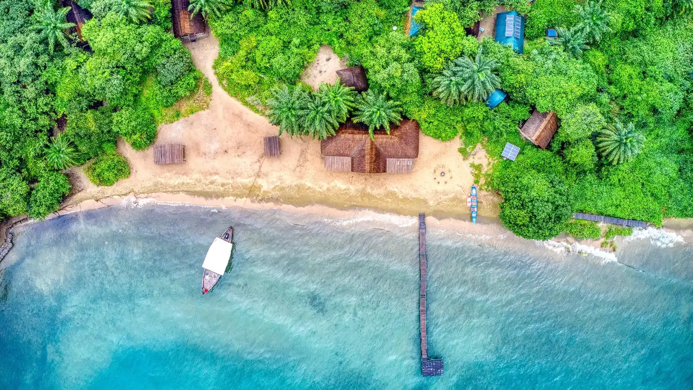 Aerial view of the beach, jetty and tents