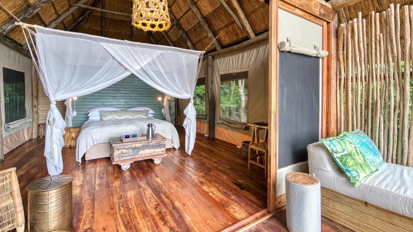 Tent bedroom with a canopy bed