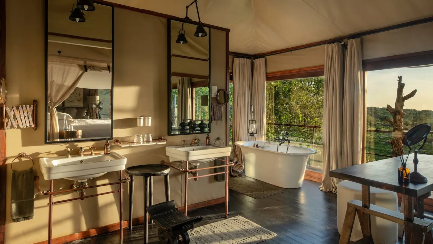 Bathroom with tub and twin basins