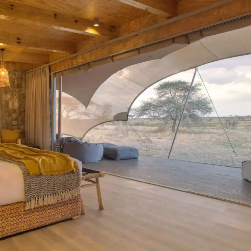 Bed with a yellow throw
