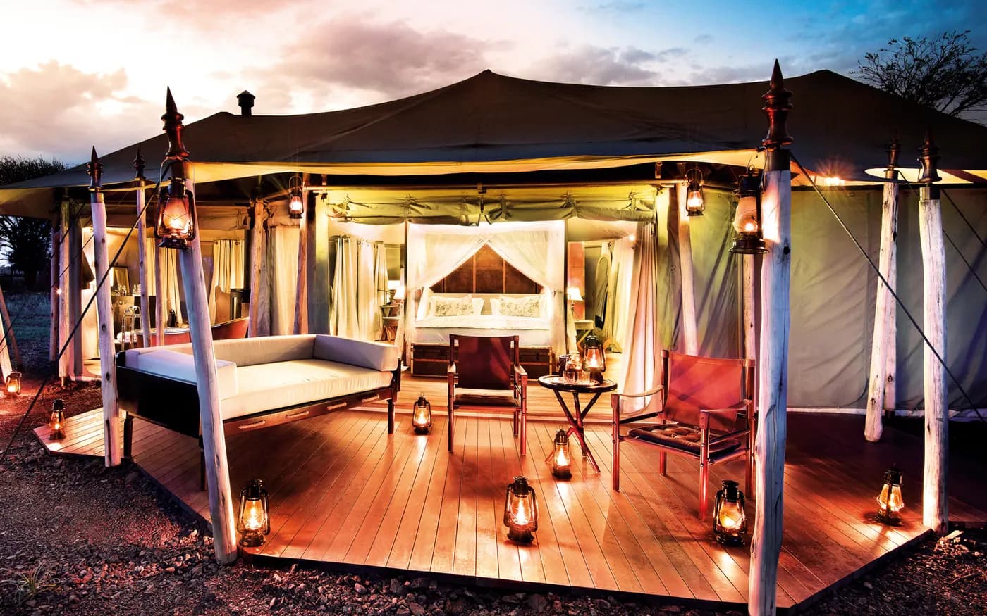 Guest tent lit at dusk
