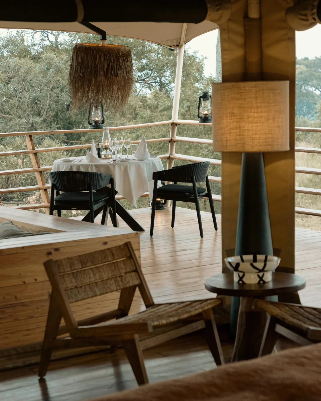 Deck dining under lanterns