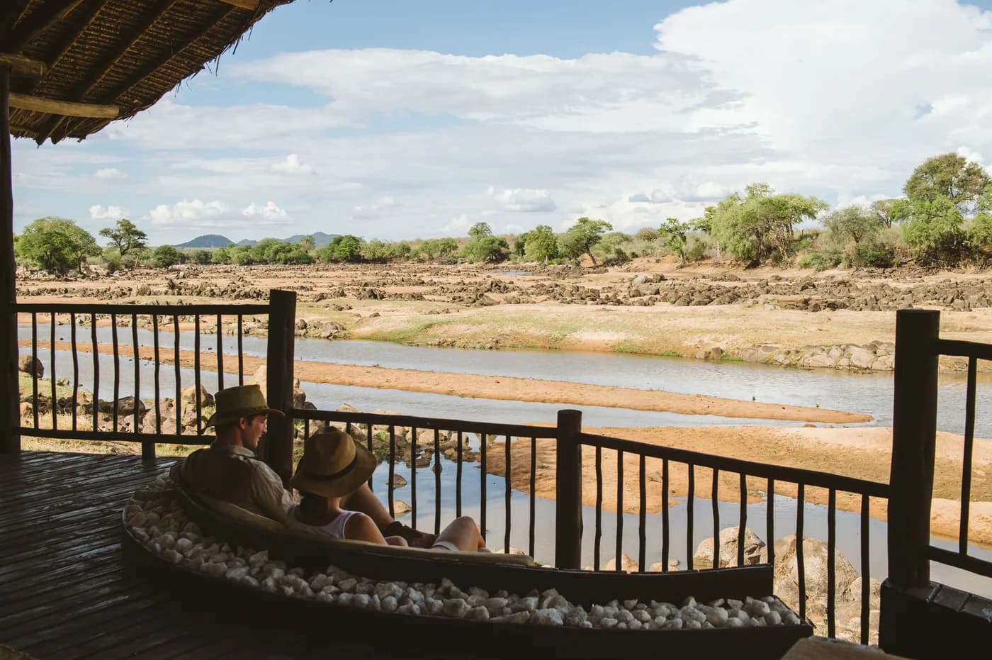 Guests on a deck above the Ruaha River