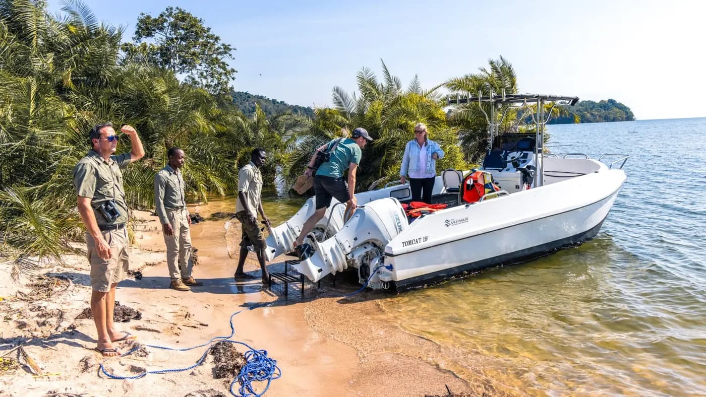 Guests boarding the boat at the beach