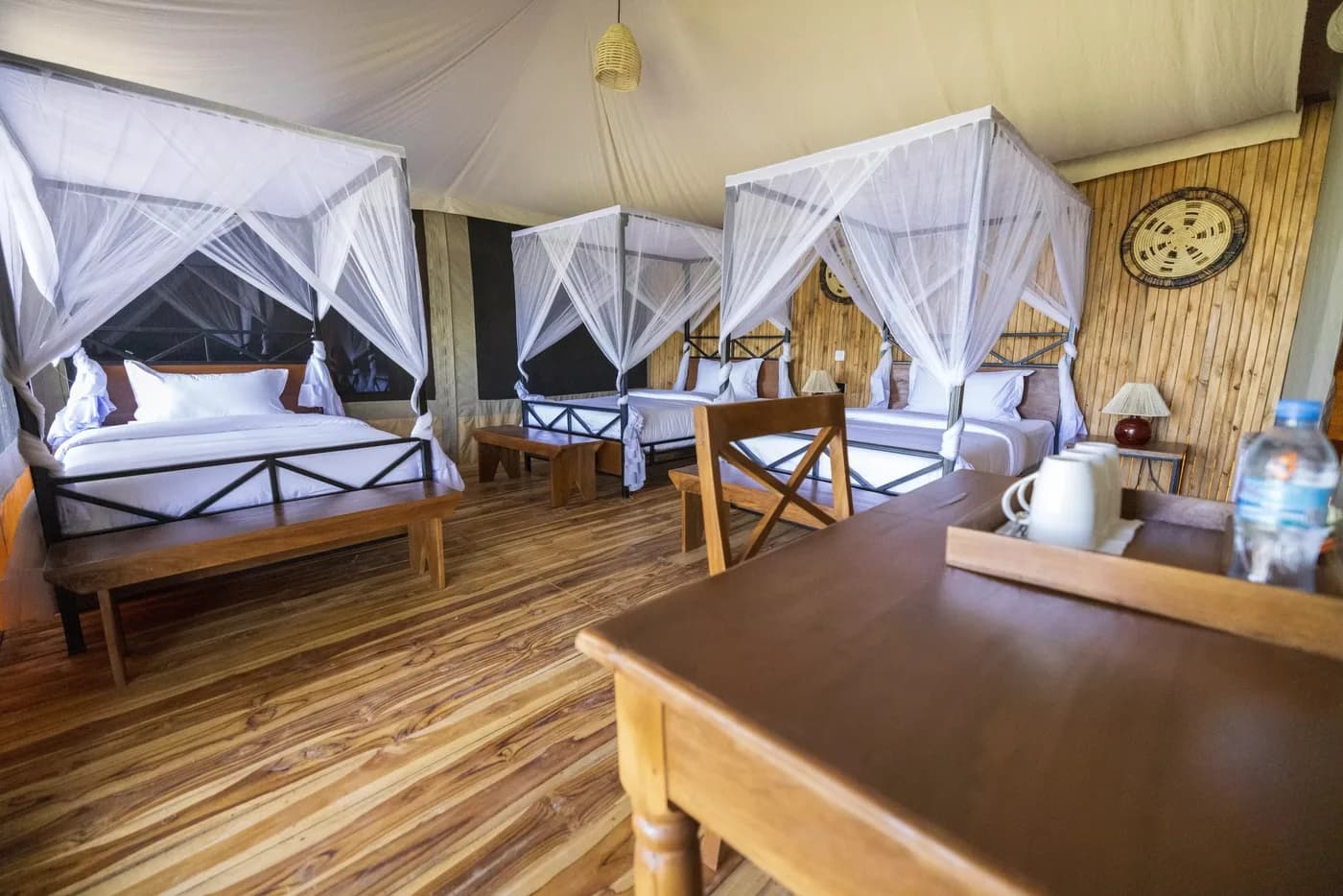 Twin beds and a desk inside a tent