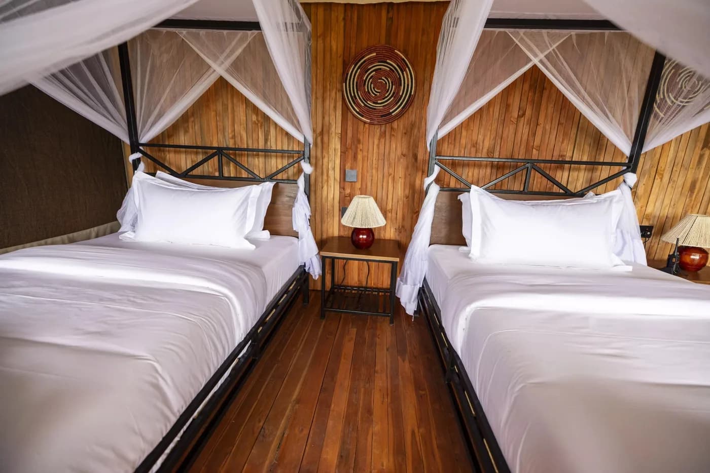 Twin beds under mosquito nets