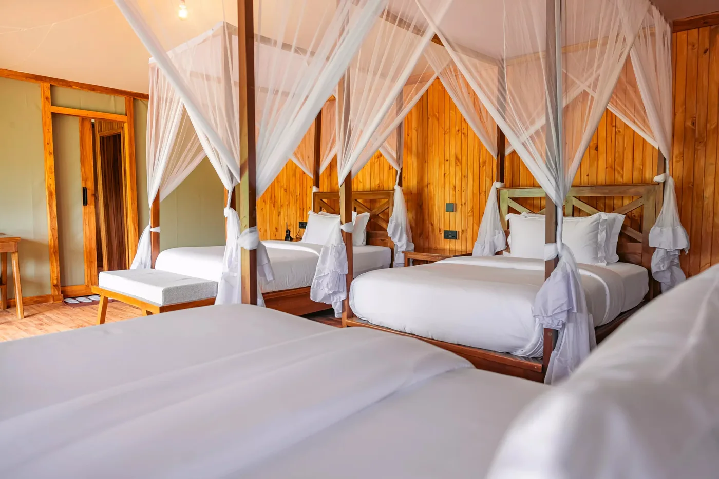 Triple tent with canopied beds