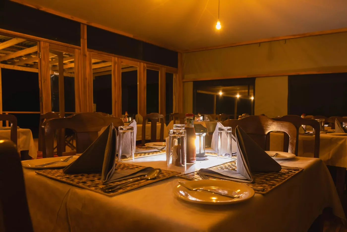 Dinner table set by lantern light