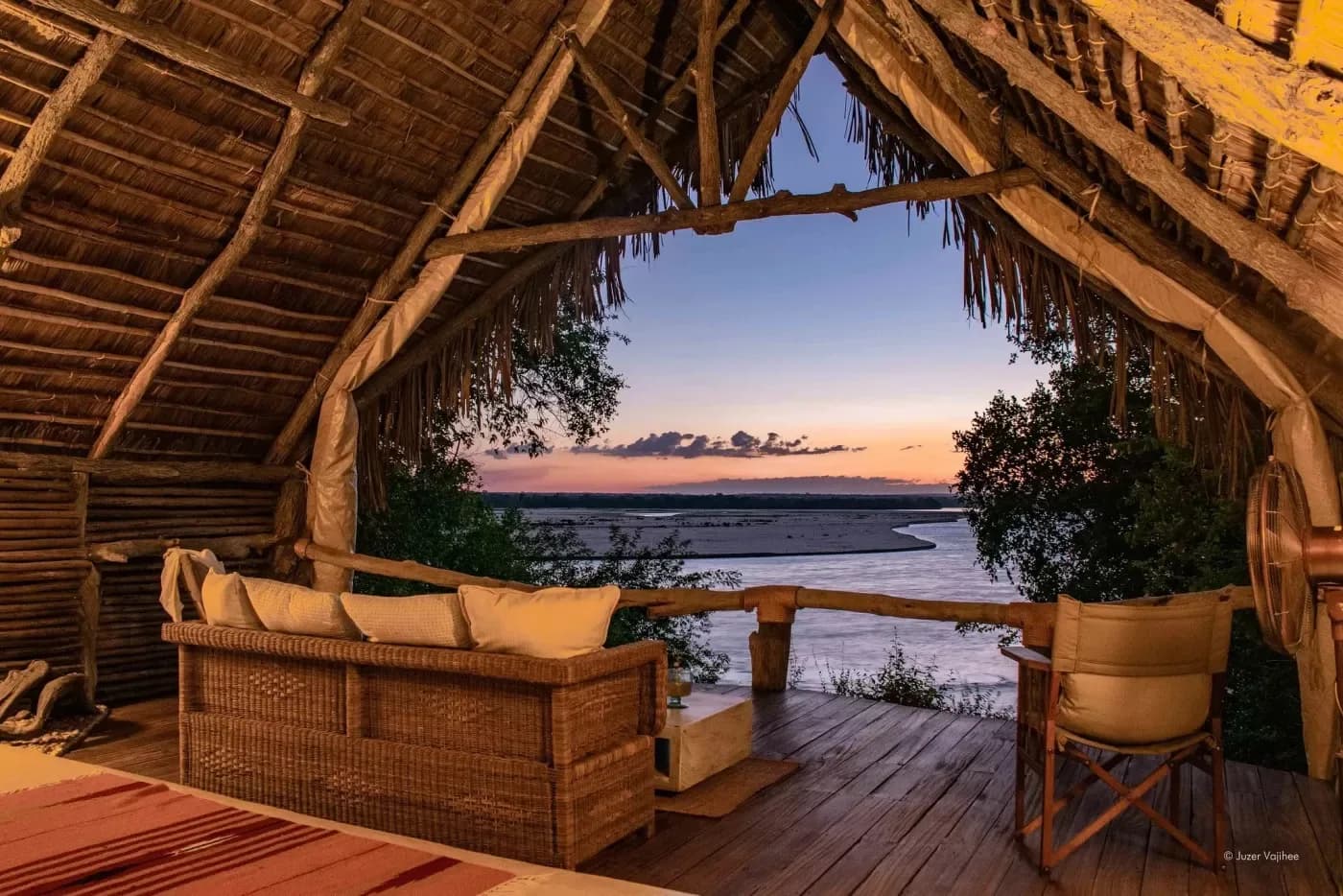 Lounge open to the river at sunset