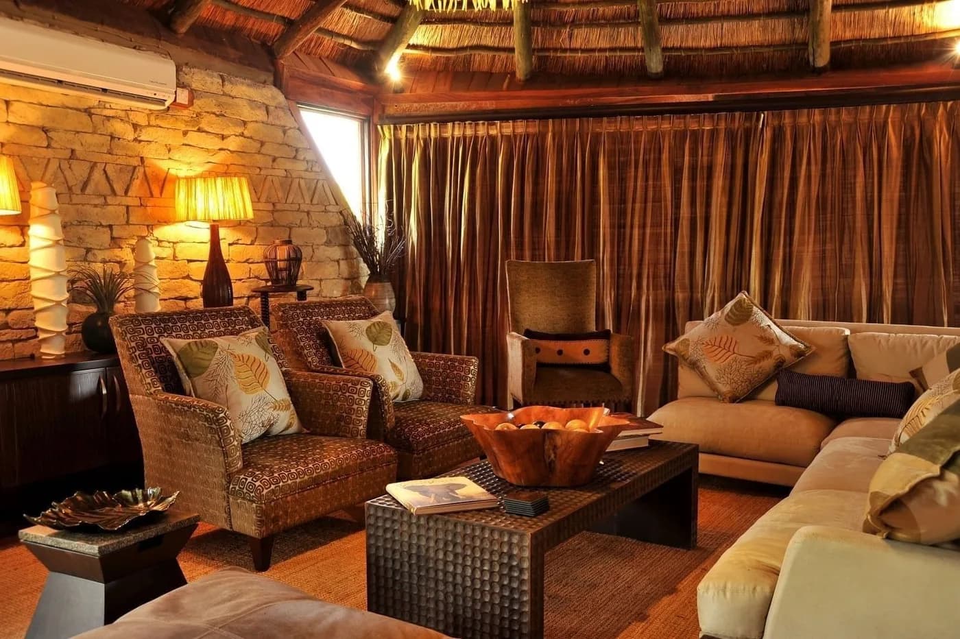 Lounge with stone walls and soft seating