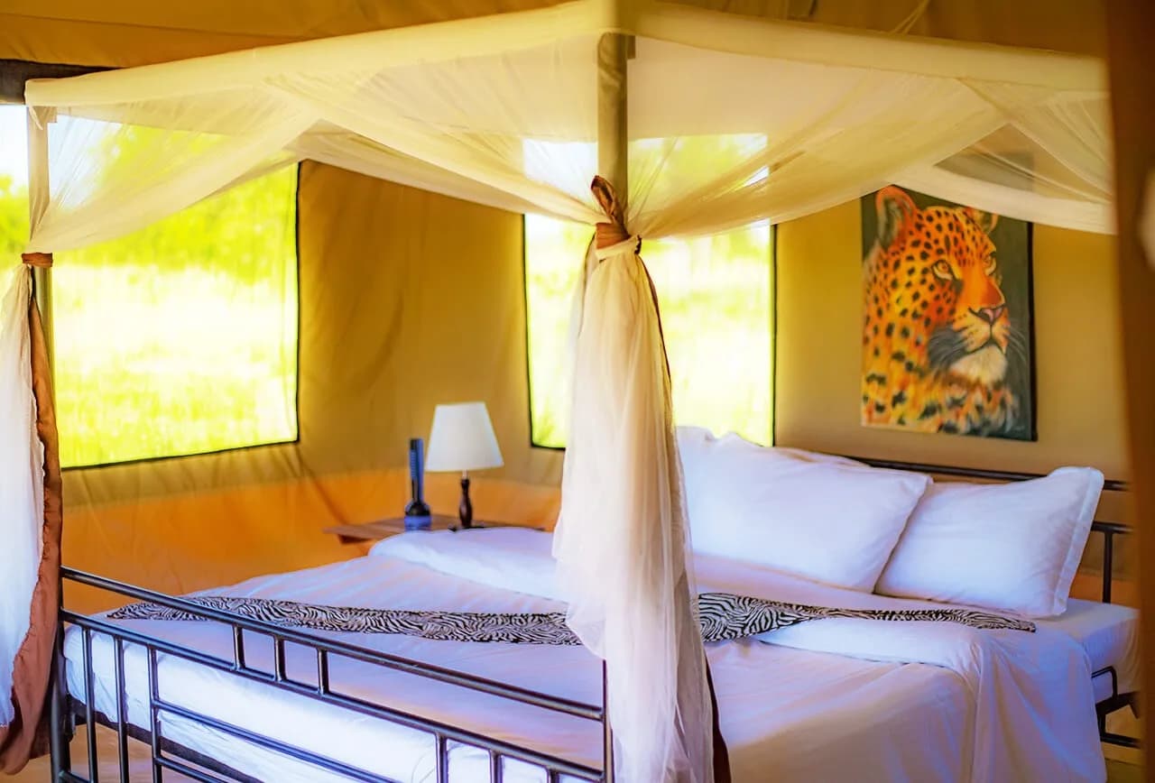 Tent with a canopied double bed