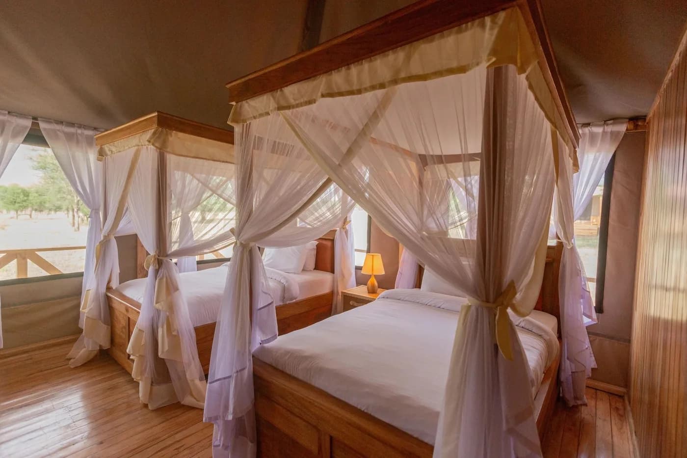Twin tent with canopied beds