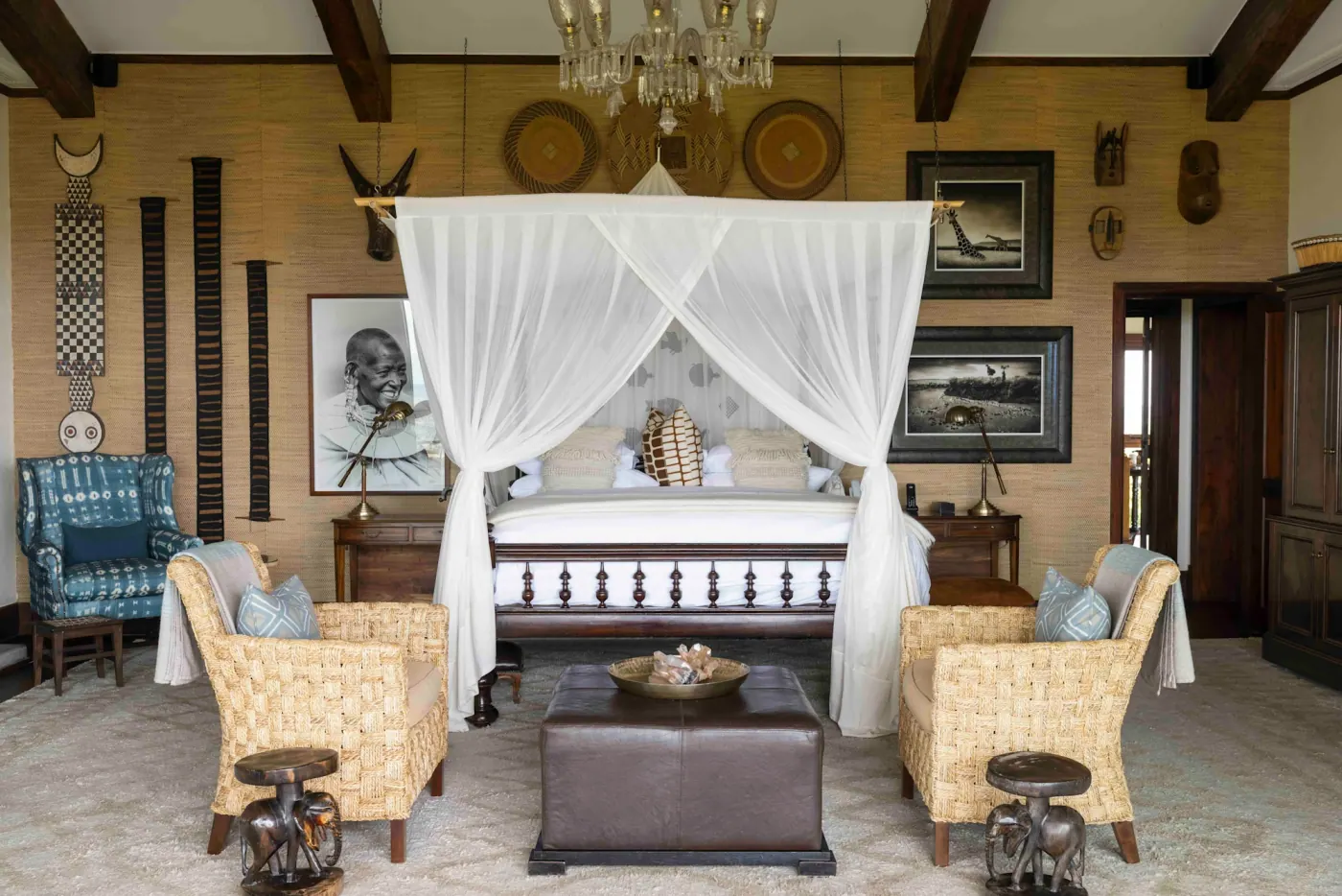 Suite bedroom under a draped canopy